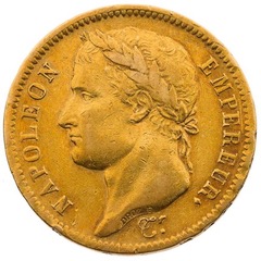 La pièce d'or : "NAPOLEON EMPEREUR" présentant Napoléon tête laurée avec comme inscirption Empereur Napoléon